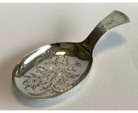 A small pierced Georgian silver caddy spoon with floral decoration. Birmingham. By Joseph Wilmore. Approx. 6 grams.
