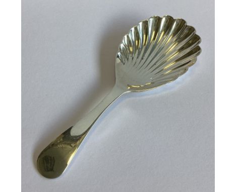 A plain silver caddy spoon with fluted bowl. Birmingham. By JS&Co. Approx. 15 grams.