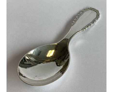 GEORG JENSEN: A good heavy silver caddy spoon of stylised form. Marked verso. Approx. 39 grams.