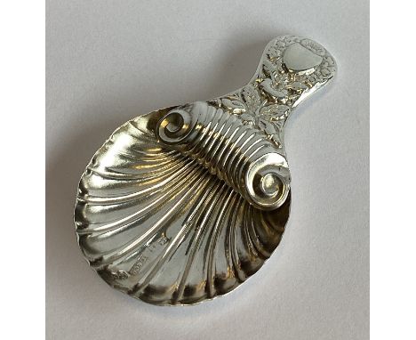 A heavy Georgian silver caddy spoon with chased decoration. Birmingham. By L&C. Approx. 10 grams.