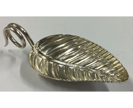 A large Georgian silver leaf-shaped caddy spoon with twisted handle. Apparently unmarked. Approx. 12 grams.
