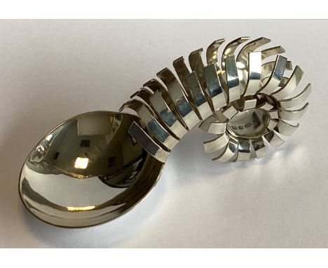 A large stylish silver caddy spoon of scroll form. Birmingham 2016. By Karina Gill. Approx. 41 grams.