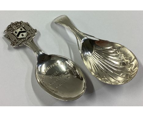 A heavy modern cast silver caddy spoon together with another silver caddy spoon. Various dates and makers. Approx. 26 grams.