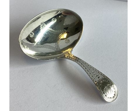 An attractive silver caddy spoon with bright-cut decoration. Birmingham 1817. Approx. 8 grams.