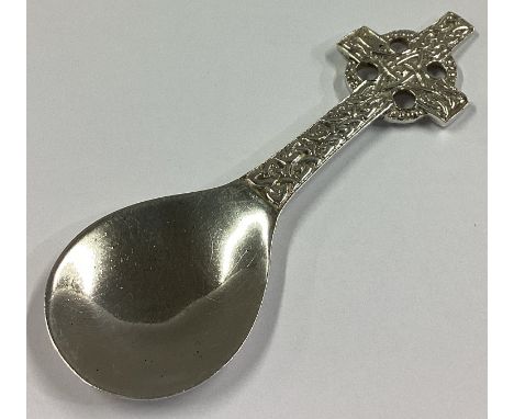 A good silver caddy spoon in the form of a Celtic cross with textured bowl. Birmingham. By RA. Approx. 21 grams.