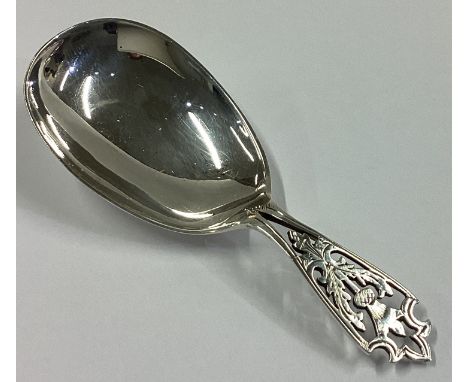 A pierced silver caddy spoon with leaf decoration. Sheffield 1926. By FC. Approx. 17 grams.