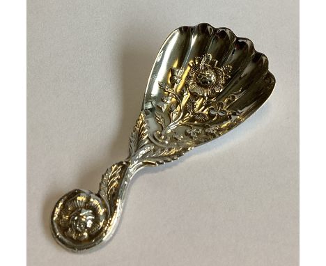 A good chased Victorian silver caddy spoon. Sheffield 1860. By MH&Co. Approx. 11 grams.