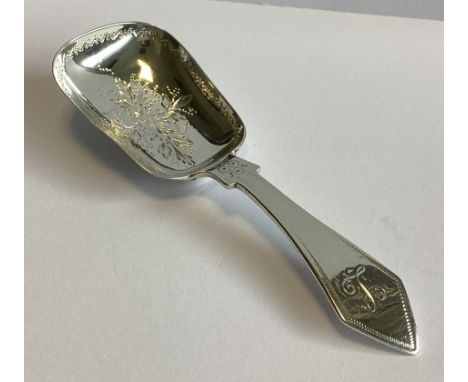 A heavy Victorian silver caddy scoop with floral decoration. London 1872. By H&H. Approx. 17 grams.