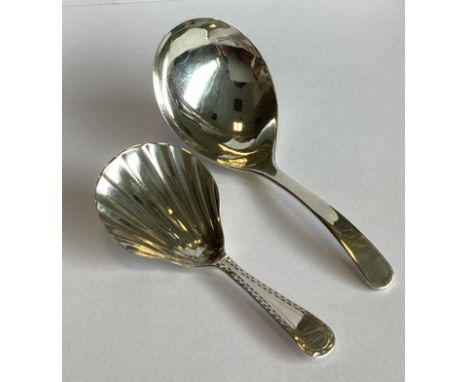 A large plain silver caddy scoop. London 1803. Together with another silver caddy spoon. Approx. 20 grams.
