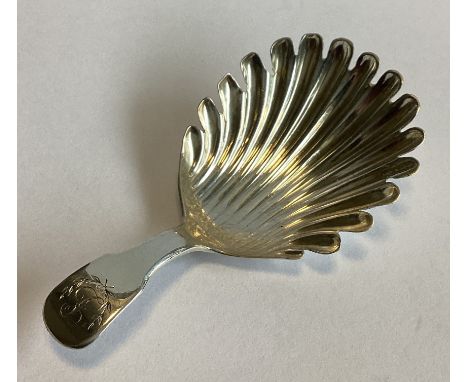 EDINBURGH: A large fluted silver caddy spoon. 1812. By H&MS. Approx. 13 grams.