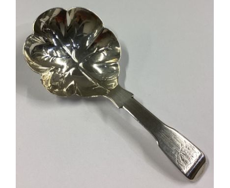 EXETER: A silver fiddle pattern caddy spoon with chased bowl. By GF. Approx. 11 grams.