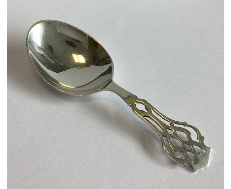 A small pierced silver caddy spoon with plain bowl. Approx. 14 grams.