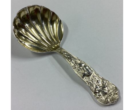 A good Victorian silver caddy spoon attractively decorated with hunting scene. London 1886. By HL. Approx. 31 grams.