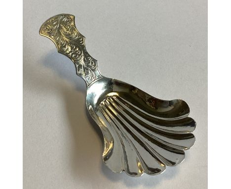 An attractive Victorian silver caddy spoon with bright-cut decoration to fluted bowl. Birmingham 1851. By TD. Approx. 8 grams