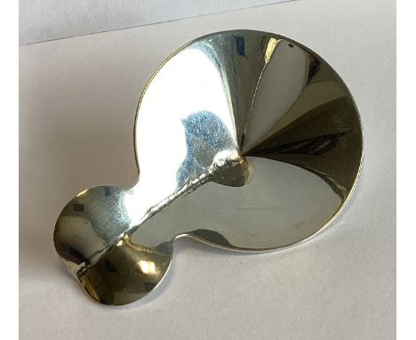A heavy Modernistic silver caddy spoon of stylised form. London 2011. By LT. Approx. 21 grams.