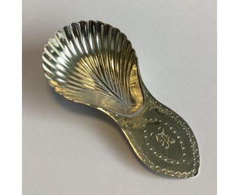 An unusual shaped Georgian silver caddy spoon with fluted bowl. By SR&GC. Approx. 10 grams.