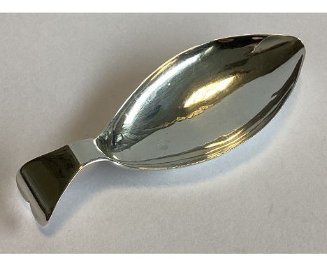A plain shaped Georgian silver caddy spoon. Birmingham. By WP. Approx. 10 grams.