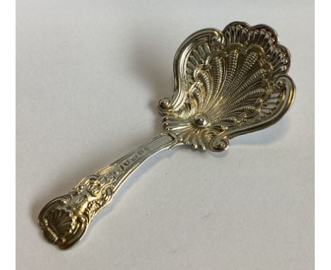 A fine quality Georgian silver hour glass pattern caddy spoon with fluted bowl. By IT. Approx. 12 grams.