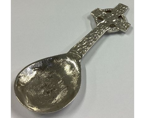 A good silver caddy spoon in the form of a Celtic cross with textured bowl. Birmingham 1944. By WJ. Approx. 22 grams.