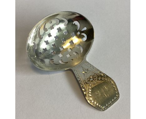 A good shaped Georgian silver caddy spoon with pierced body. London. By DO&MH. Approx. 10 grams.