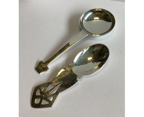 A stylish pierced silver caddy spoon. London 1987. By KB. Together with another similar example. Approx. 29 grams.