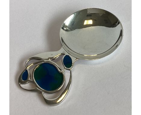 LIBERTY & CO: A stylish silver and blue enamelled caddy spoon of typical form. Edinburgh 1987. Approx. 18 grams. 