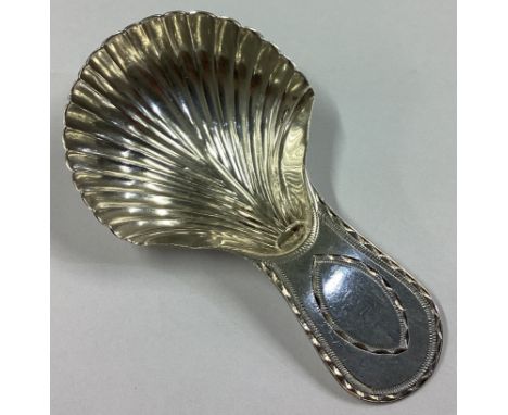 A Georgian silver caddy spoon with bright-cut decoration. London 1745. By GJ. Approx. 6 grams.