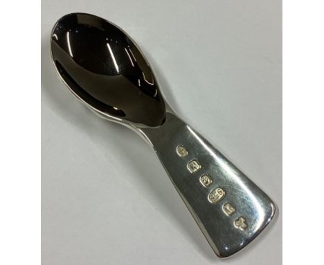 A heavy fluted silver 'Black Gold' caddy spoon with spiralled and textured decoration. London 2018. By Wayne Meeten. Approx. 
