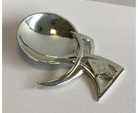 A heavy silver caddy spoon of stylised form. London 2012. By A&D. Approx. 34 grams.