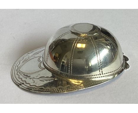 A good quality Georgian silver caddy spoon in the form of a jockey cap with bright-cut decoration. Birmingham. By IT. Approx.