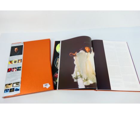 Freddie Mercury - The Solo Collection, a ten compact disc and two DVD with hardcover presentation book boxed set housed in sl