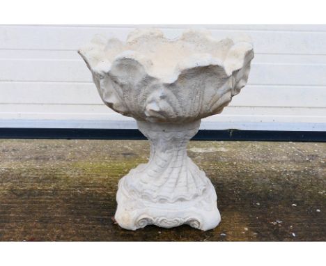 A reconstituted stone garden planter, approximately 49 cm (h). [W]