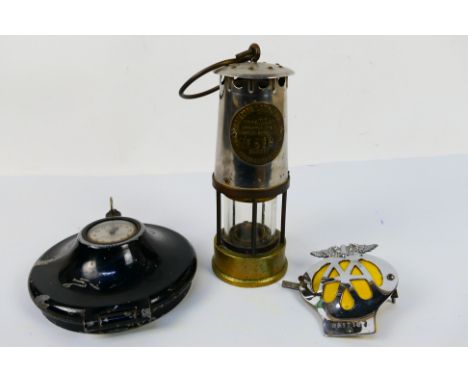 A Protector Lamp & Lighting Co Ltd Type MC40 safety lamp numbered 516, a vintage Servis Recorder tachograph and AA badge. [W]