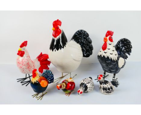 A quantity of ceramic models in the form of hens and cockerels, largest approximately 34 cm (h). [W]NOTE: THIS LOT IS NOT AVA