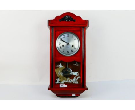 A Polaris 15 day wall clock. [W]