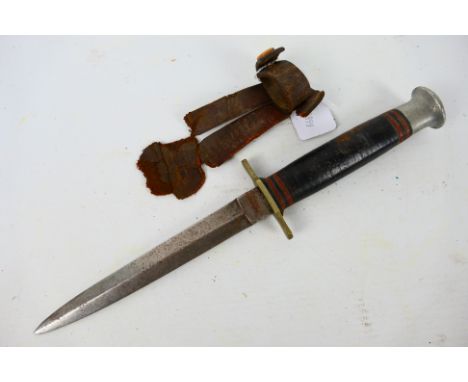 A W H Fagan & Son Fairbairn Sykes style fighting knife, 14 cm blade, with remains of leather sheath. [W]Note: This lot is not
