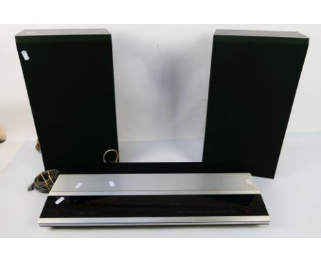 Bang & Olufsen - A Beomaster 2000 and a pair of Beovox X35 speakers. [3]. [W]Condition Report: The item is fitted with 2 pin 