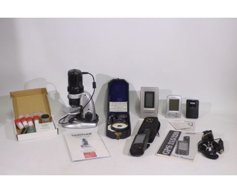 A Traveler USB Microscope, Magellan GPS system, clock and hygrometer and other. [2]. [W]