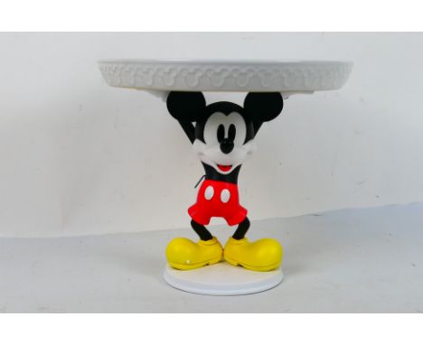 Disney - A Mickey Mouse cake stand, approximately 24 cm (h), contained in original shipping packaging. [W]