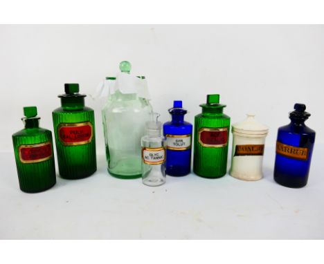 Various apothecary and similar jars to include ceramic, blue glass, green glass and clear, largest 31 cm (h). [W]