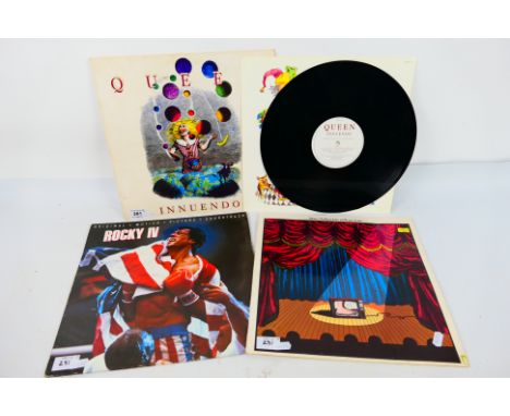 A small quantity of 12" vinyl records to include Queen Innuendo PCSD115, Monty Python Live At Drury Lane and Rocky IV Soundtr