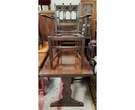 An Ercol extending refectory dining table and similar chairs. 