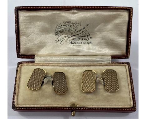 A 9 carat hallmarked gold pair of engine turned cufflinks of canted rectangular form,&nbsp;11.15gm