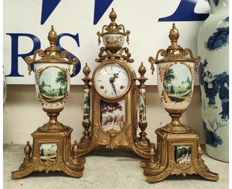 A modern reproduction gilt &amp; ceramic clock garniture decorated with French chateaux scenes, dial lettered imperial, made 