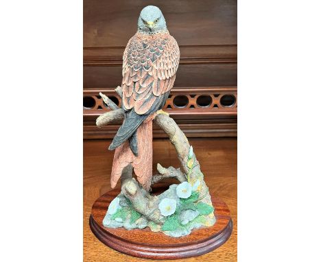 A Border Fine Arts group:&nbsp; Red Alert, bird of prey on branch, limited edition 32/350, signed K Sherwin, height 34c 