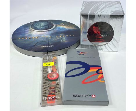 A Swatch Watch originally boxed 'The Club Special Follow the Light' No/2800/20,000;&nbsp;A Swatch Watch, originally boxed Sin