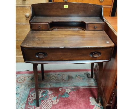 An Ercol writing desk with raised shelf back and frieze drawer, 69 x 47 x 95cm