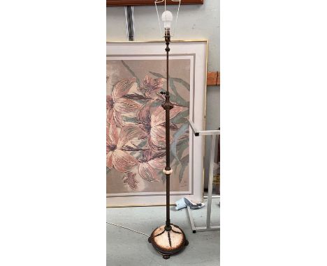 A brass telescoping standard lamp with marble base and claw feet 
