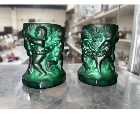 A pair of "Malachite glass" candlesticks in he manner of Frantisek Pazourek, decorated with dancing children, height 7.5cm.&n