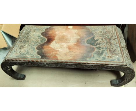 A Chinese carved hardwood low table with rectangular top on 'C' scroll legs, width 102cm (top water stained)&nbsp;Generally g